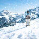 Produktfoto Bier einer Privatbrauerei im Winter mit den Allgäuer Bergen